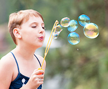 A child blowing bubbles