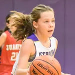 A girl playing basketball