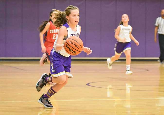 A girl playing basketball