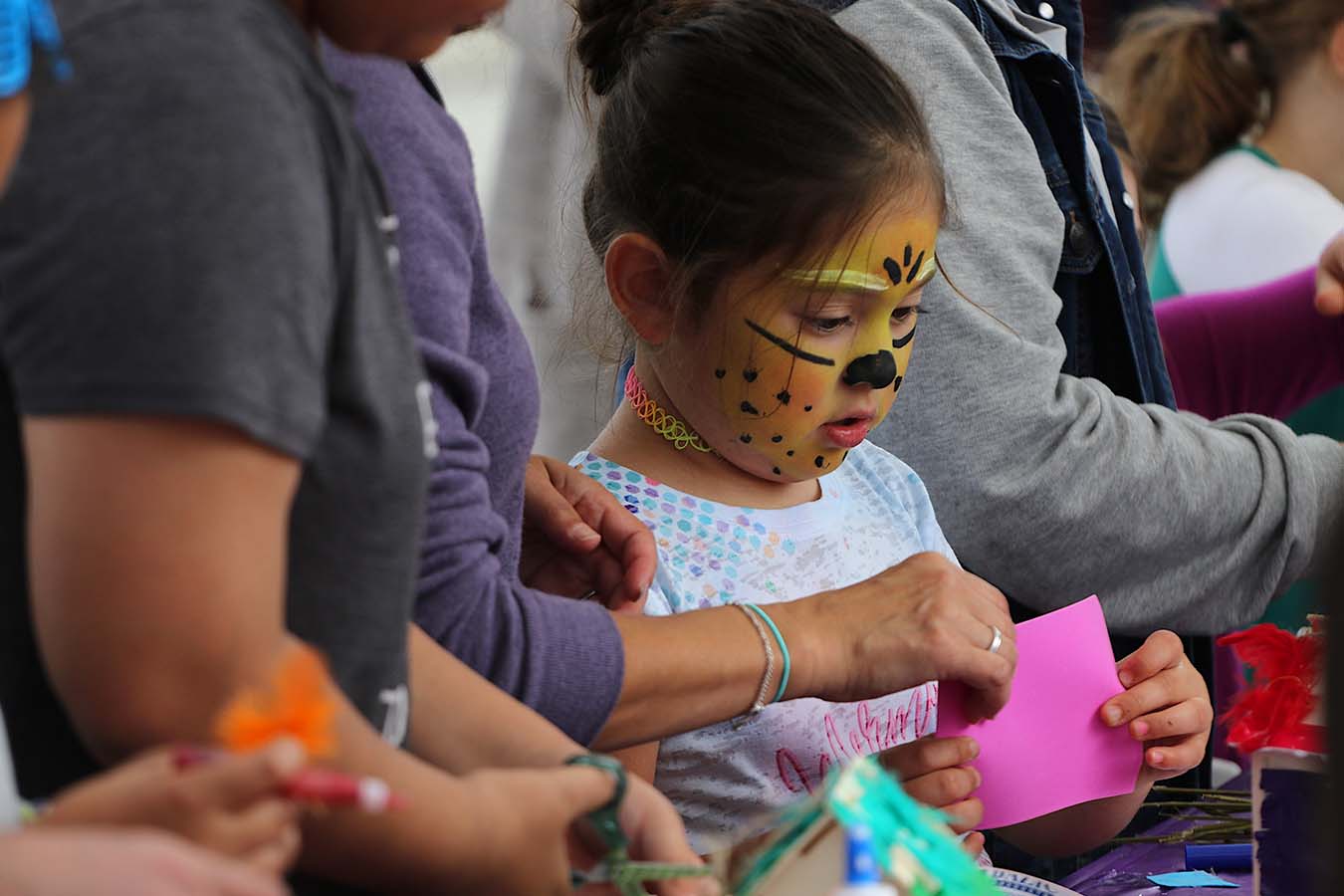 A girl builds a birdhouse at an event at the Odessa Brown Children's Clinic Othello.