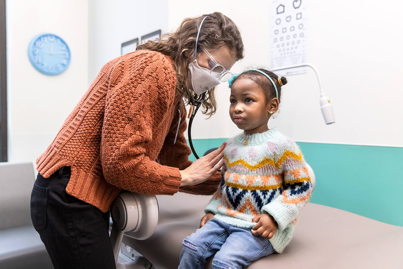 Doctor with stethoscope and child