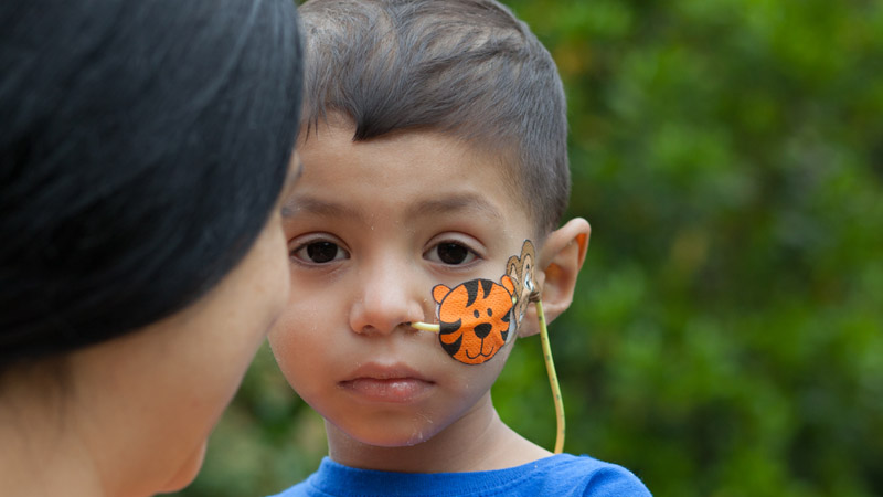 A child looks at the camera