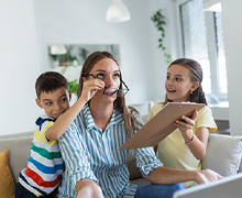 Frustrated mom sits with two children