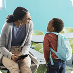 teacher and kiddo in classroom