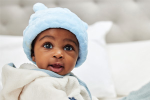 A child in a winter coat and hat